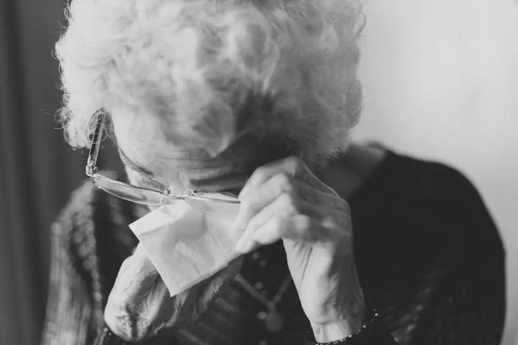 Lady wiping her eyes